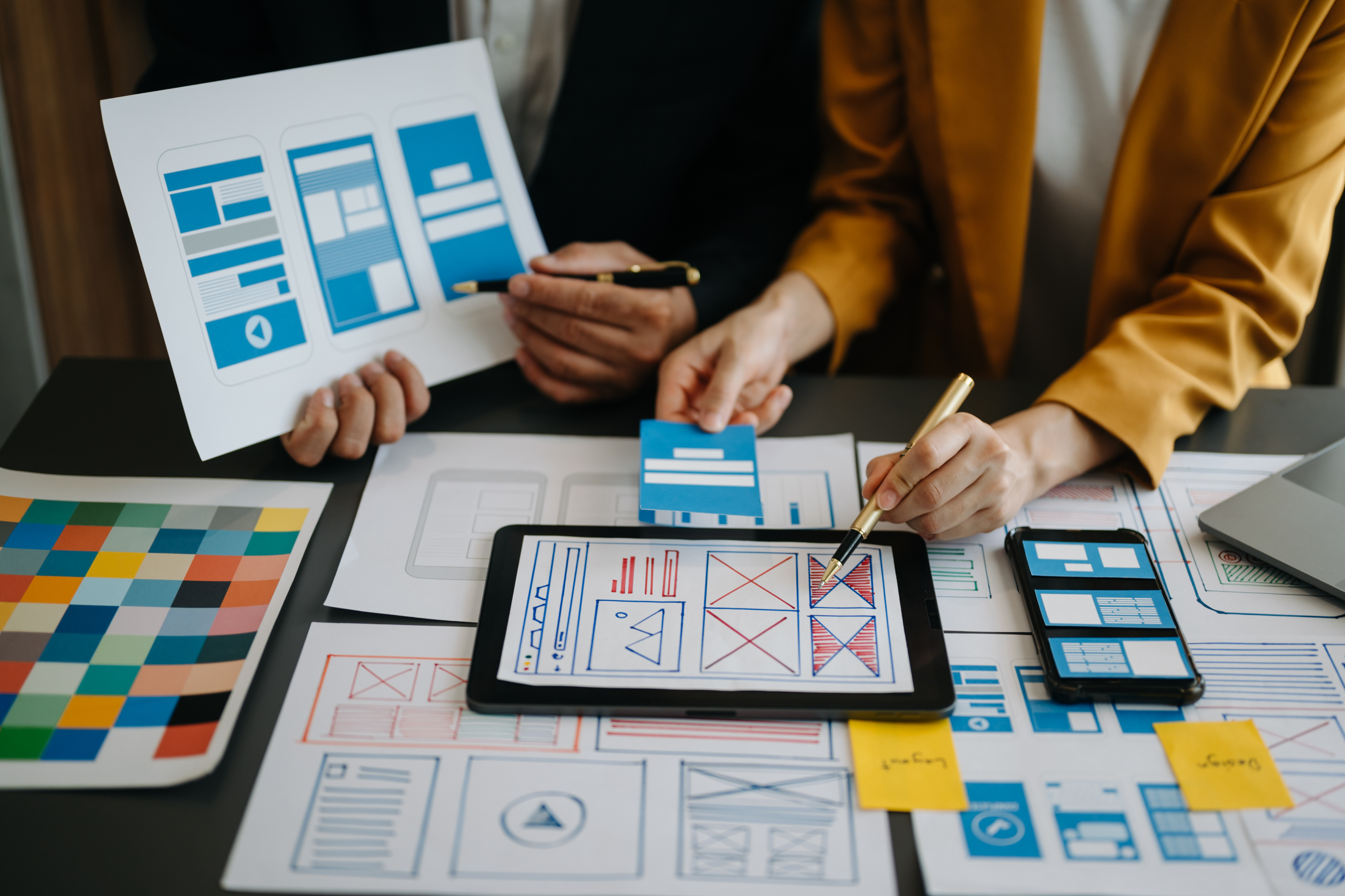Web design team working on UI mockups